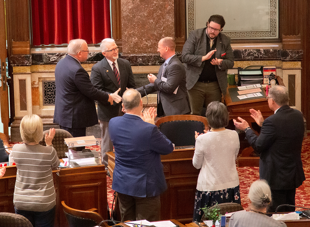 VP John Lawrence applauded on Iowa Senate floor