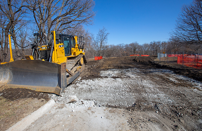 Grader sits adjacent to realigned road bed