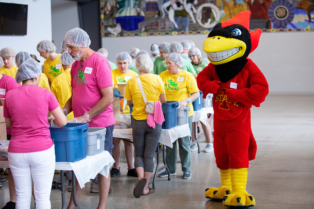 Teams in color-coded T-shirts package meals