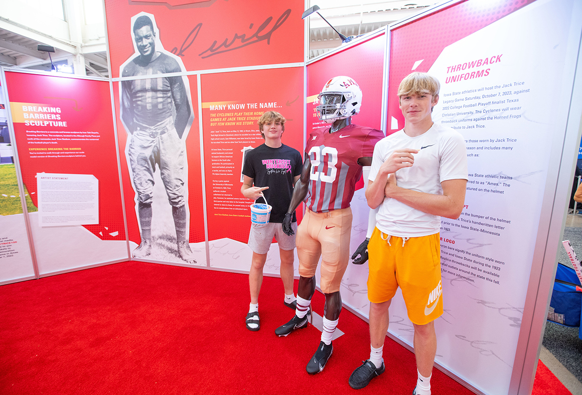 Teen brothers admire the 1923-inspired Cyclone football jersey