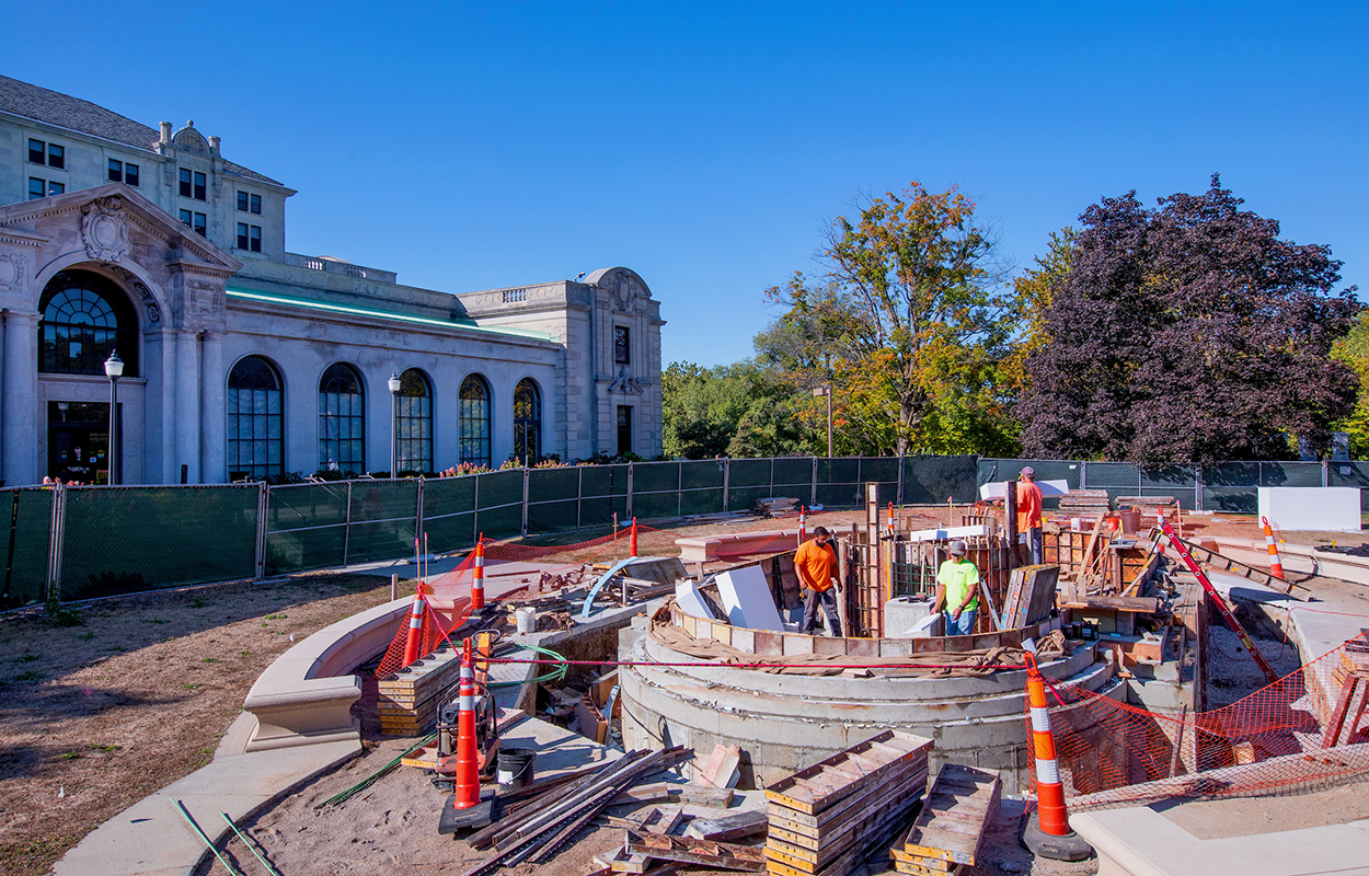 Workers set forms in new concrete pool