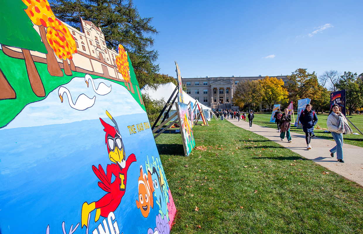Colorful banners line the central campus sidewalk